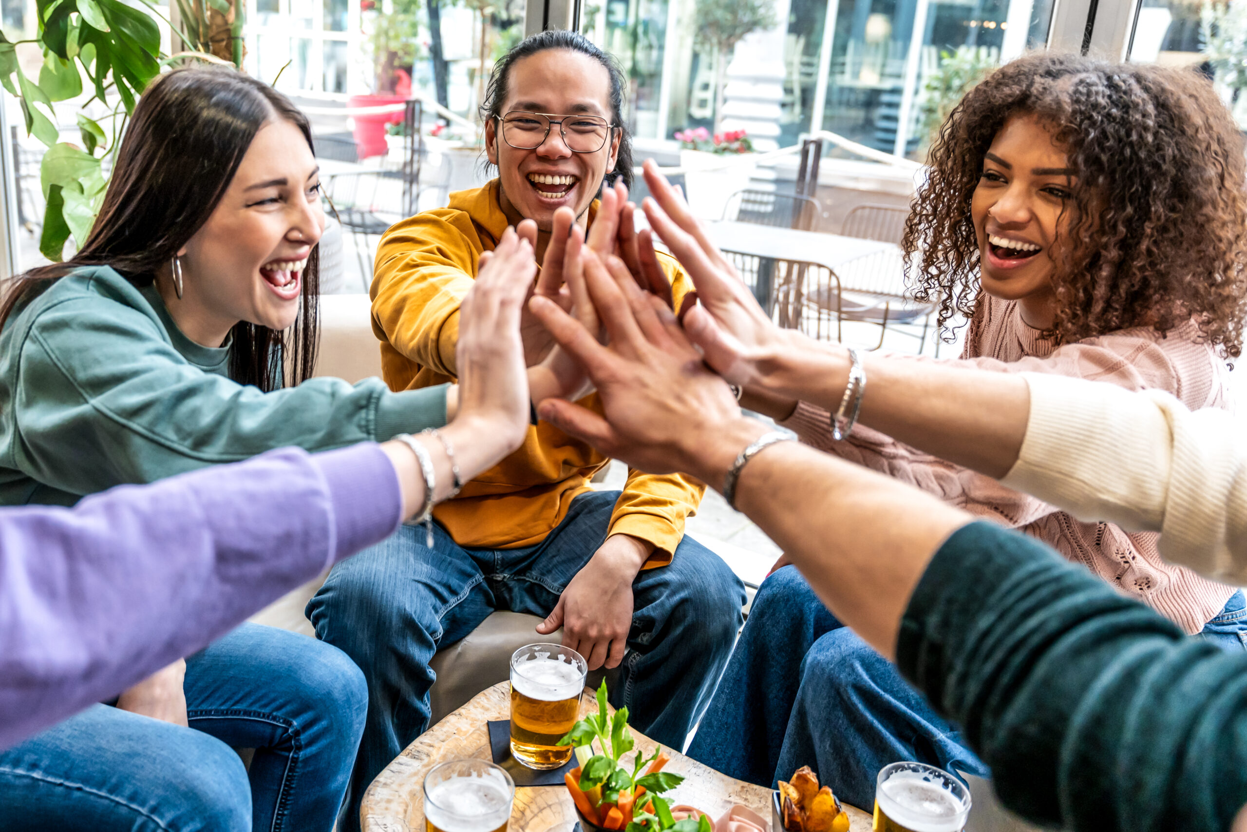 group-of-multiracial-happy-young-people-stacking-h-2025-02-12-22-56-01-utc-1-scaled.jpg